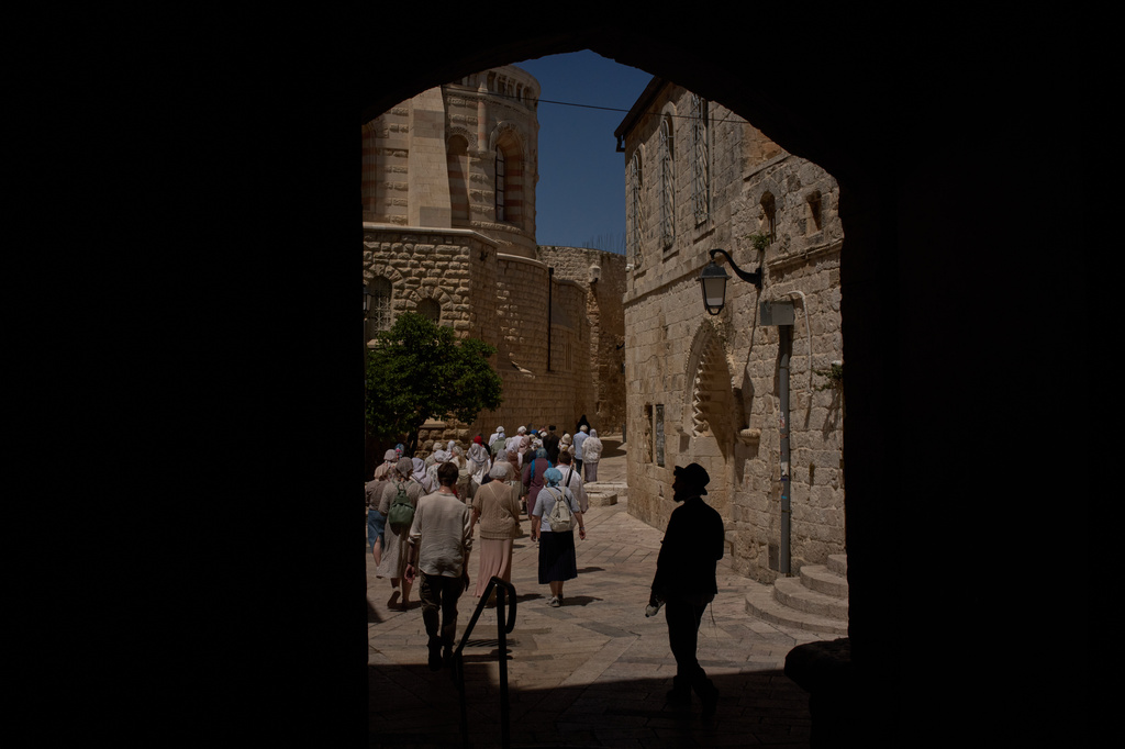 FILE - Christian pilgrims walk past the site where a nun was attacked by a man last Wednesday, after visiting the Cenacle, traditionally believed to be the site of the Last Supper, in Jerusalem, Friday, May 1, 2026. (AP Photo/Leo Correa, File)
