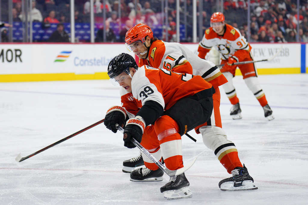 Philadelphia Flyers' Matvei Michkov, front, reaches for the puck past Anaheim Ducks' Cutter Gauthier during the second period of an NHL hockey game, Saturday, Oct. 24, 2026, in Philadelphia. (AP Photo/Derik Hamilton)
