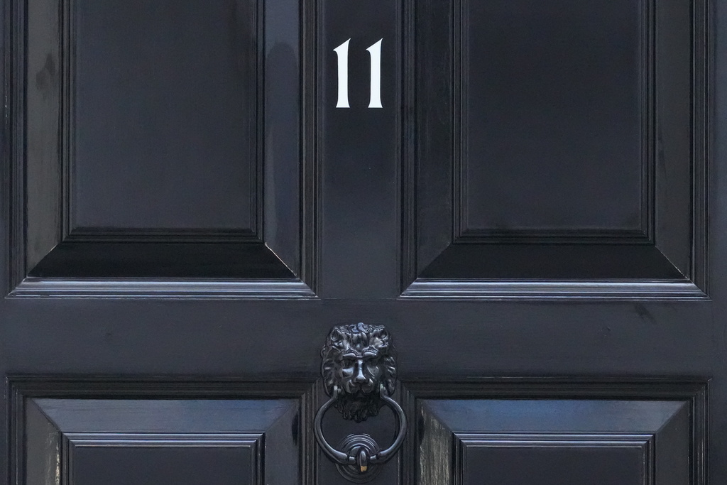 The front door to 11 Downing Street, official home of Britain's Chancellor of the Exchequer Rachel Reeves, who will deliver her governments spending plans later Wednesday to Parliament, in London, Wednesday, Nov. 26, 2025. (AP Photo/Frank Augstein)