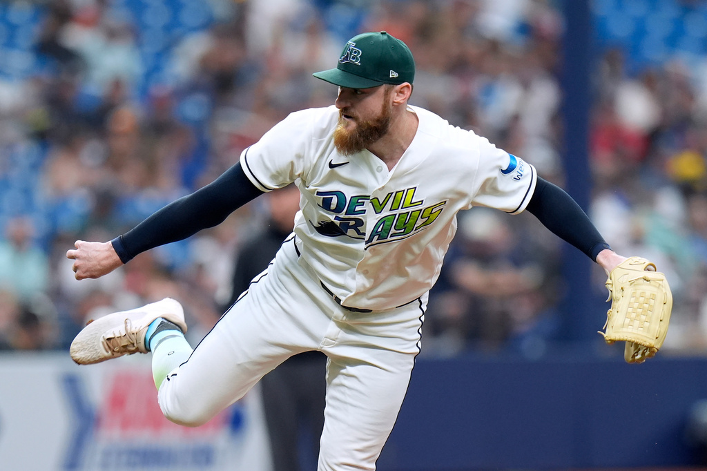 Tampa Bay Rays pitcher Bryan Baker follows through on a delivery against the Cleveland Guardians during the ninth inning of a baseball game Sunday, July 26, 2026, in St. Petersburg, Fla. (AP Photo/Chris O'Meara)