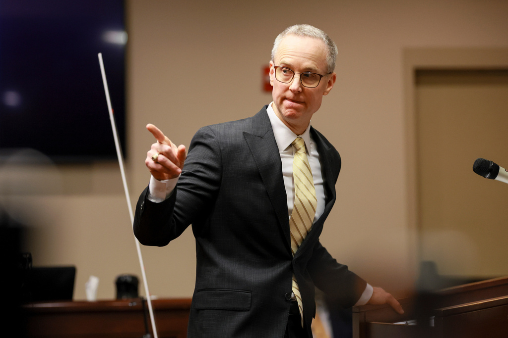 District Attorney Brad Smith points to the defendant Colin Gray, the father of Apalachee High School shooting suspect Colt Gray, during Smith's opening statements in the courtroom at the Barrow County courthouse, Monday, Feb. 16, 2026, in Winder, Ga. (Jason Getz/Atlanta Journal-Constitution via AP)