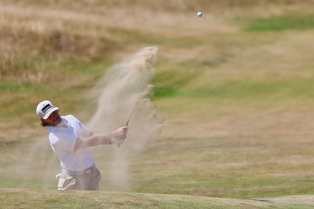Tommy Fleetwood of England plays out of a bunker on the 13th hole during a practice round for the British Open Golf championships at Royal Birkdale golf club, in Southport, England, Tuesday, July 14, 2026. (AP Photo/Peter Morrison)