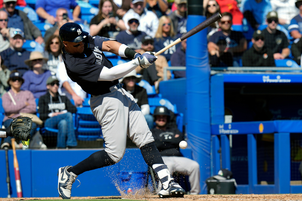 New York Yankees' Aaron Judge connects for a single off Toronto Blue Jays pitcher Jesse Hahn during the fifth inning of a spring training baseball game Tuesday, Feb. 24, 2026, in Dunedin, Fla. (AP Photo/Chris O'Meara)