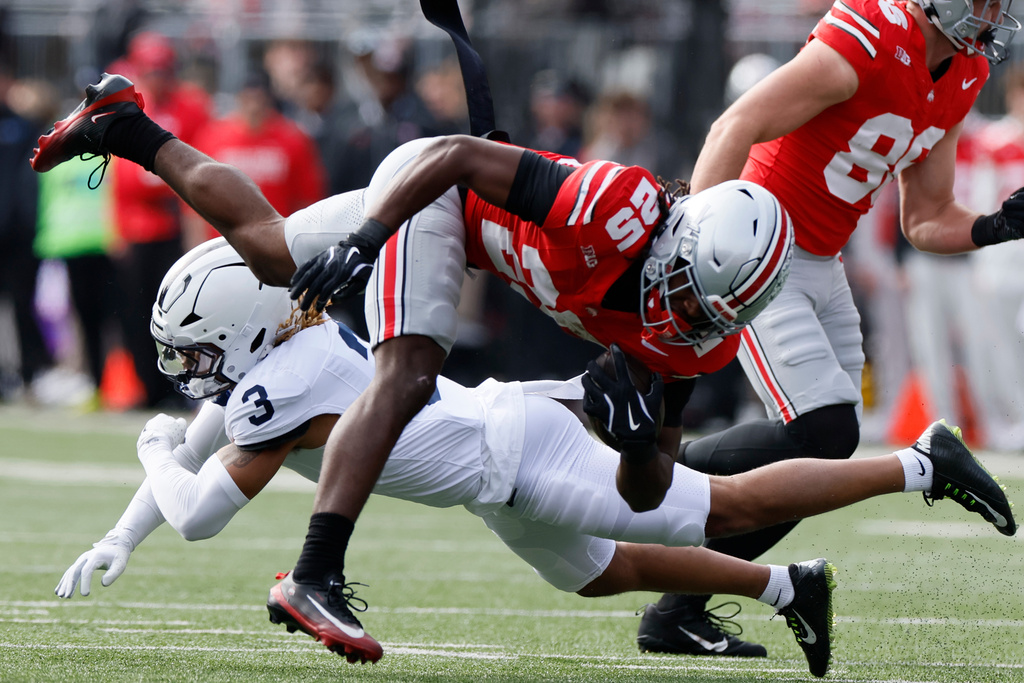 Ohio State running back Bo Jackson, top, is tackled by Penn State defensive back Antoine Belgrave-Shorter during the first half of an NCAA college football game, Saturday, Nov. 1, 2025, in Columbus, Ohio. (AP Photo/Jay LaPrete)