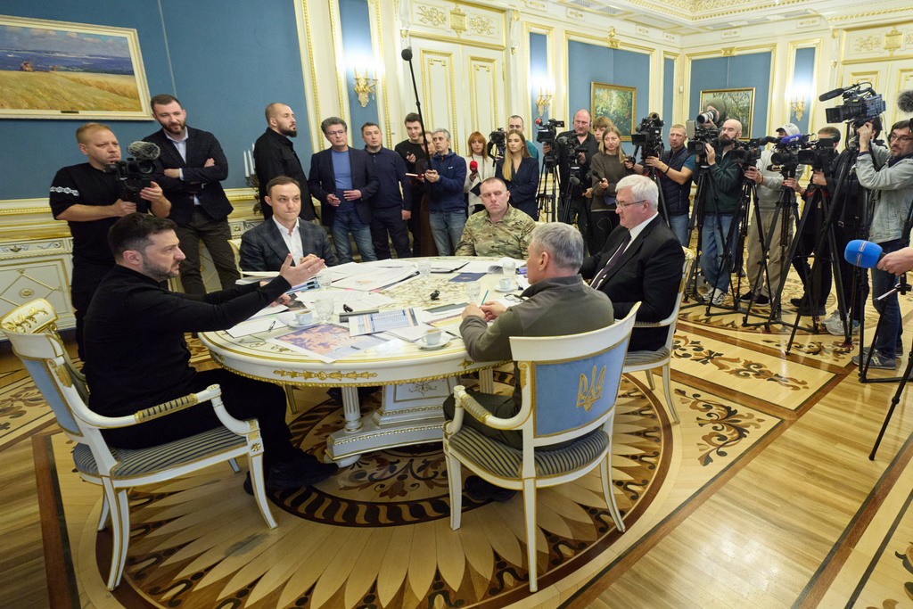 In this photo provided by the Ukrainian Presidential Press Office, Ukrainian President Volodymyr Zelenskyy, front left, attends a news conference in Kyiv, Ukraine, Friday, Oct. 31, 2025. (Ukrainian Presidential Press Office via AP)