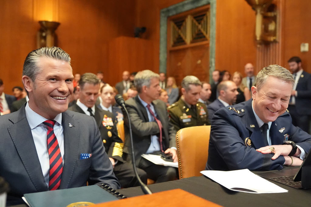 Defense Secretary Pete Hegseth and Chairman of the Joint Chiefs of Staff Gen. Dan Caine arrive for a Senate Appropriations subcommittee on defense hearing on the budget request for the Department of Defense, Tuesday, May 12, 2026, in Washington. (AP Photo/Alex Brandon)