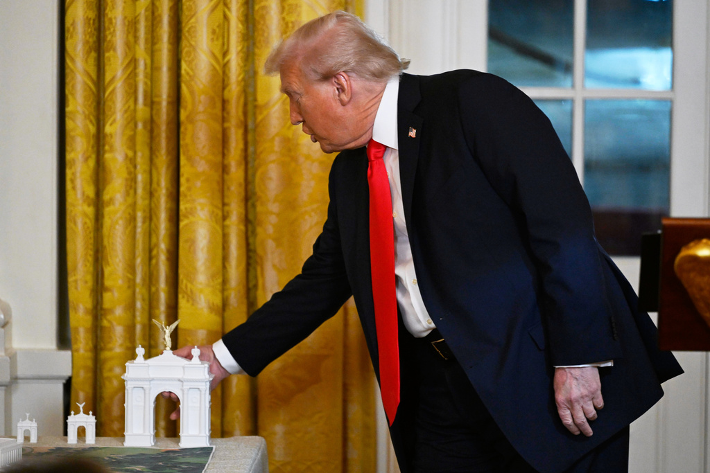 President Donald Trump addresses a dinner for donors who have contributed to build the new ballroom at the White House, Wednesday, Oct. 15, 2025, in Washington. (AP Photo/John McDonnell)