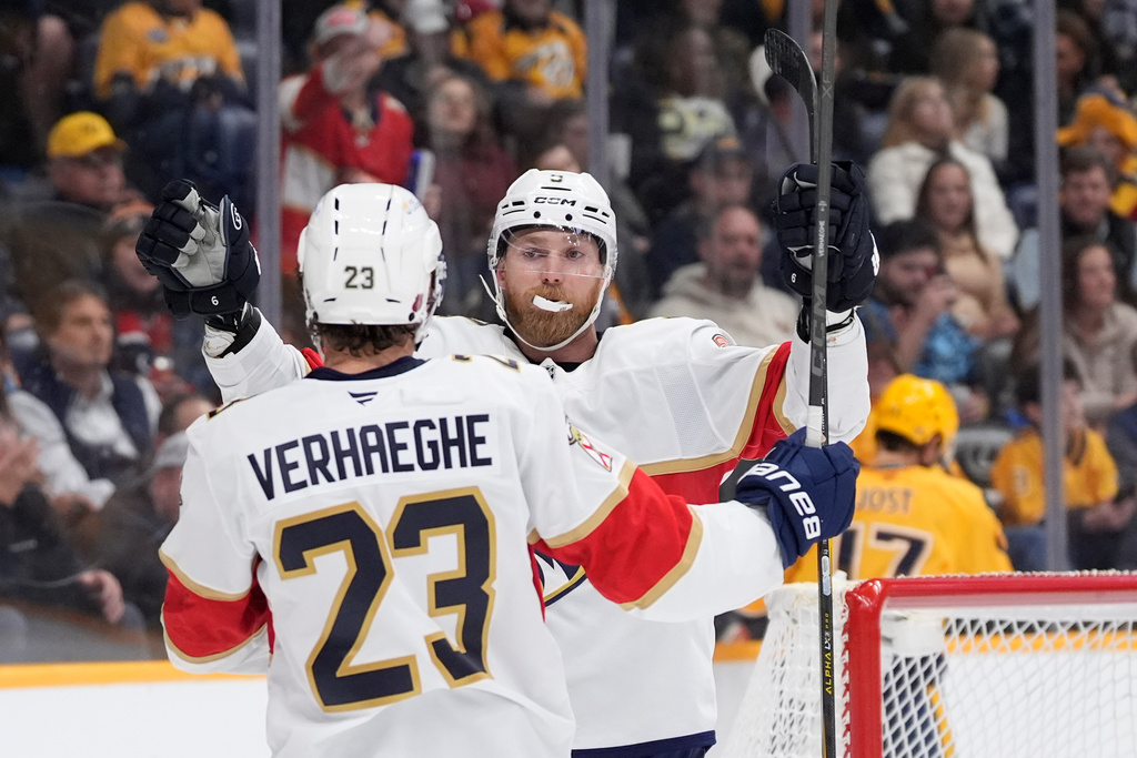 Florida Panthers center Sam Bennett, right, celebrates his goal with teammate Carter Verhaeghe (23) during the first period of an NHL hockey game against the Nashville Predators, Monday, Nov. 24, 2025, in Nashville, Tenn. (AP Photo/George Walker IV)