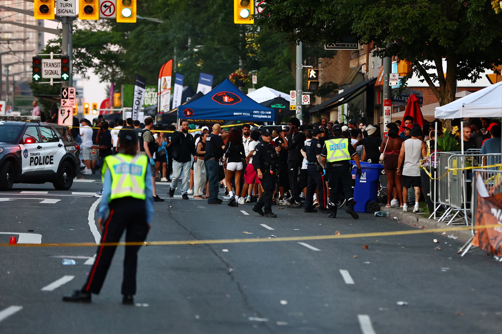 Police respond to an active shooter at the Salsa on St. Clair event in Toronto, Saturday, July 11, 2026. (Keito Newman/The Canadian Press via AP)