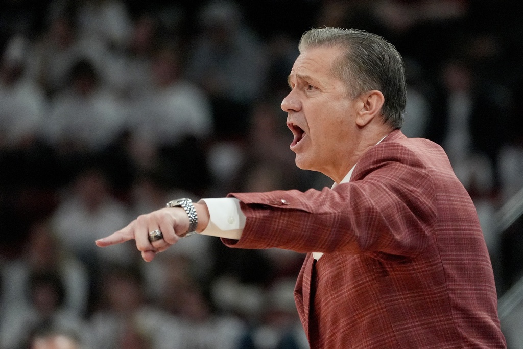Arkansas head coach John Calipari calls out to his team during the first half of an NCAA college basketball game against Mississippi State, Saturday, Feb. 7, 2026, in Starkville, Miss. (AP Photo/Rogelio V. Solis)