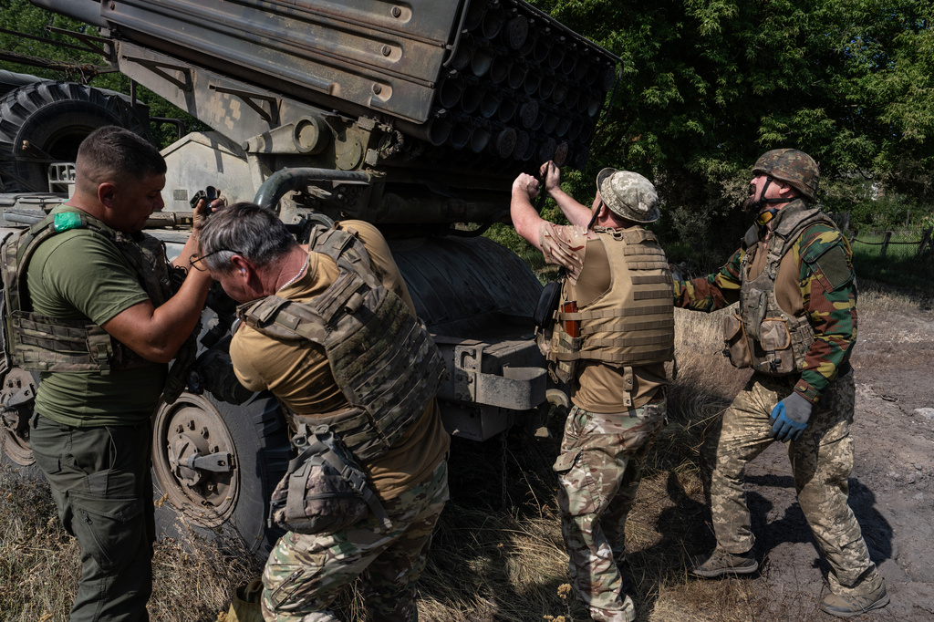 In this photo provided by Ukraine's 93rd Kholodnyi Yar Separate Mechanized Brigade press service, soldiers prepare an MRLS BM-21 "Grad" to fire at Russian positions near the frontline city of Kramatorsk, Donetsk region, Ukraine, Tuesday, Aug. 4, 2026. (Iryna Rybakova/Ukraine's 93rd Mechanized Brigade via AP)