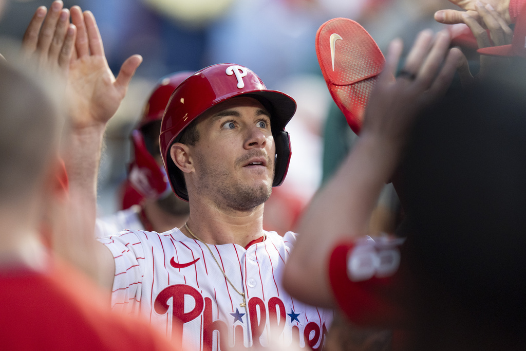 Philadelphia Phillies' J.T. Realmuto celebrates his run on the double by Nick Castellanos during the first inning of a baseball game against the New York Mets, Tuesday, Sep. 9, 2025, in Philadelphia. (AP Photo/Chris Szagola)
