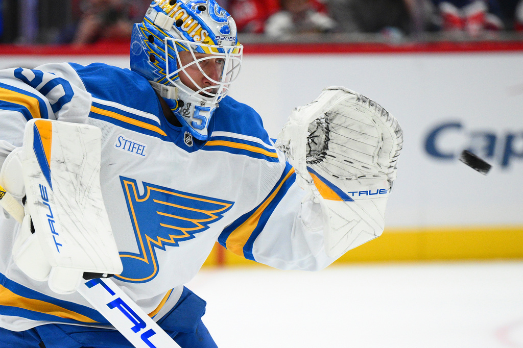 St. Louis Blues goaltender Jordan Binnington (50) stops a puck during the first period of an NHL hockey game against the Washington Capitals, Wednesday, Nov. 5, 2025, in Washington. (AP Photo/Nick Wass)