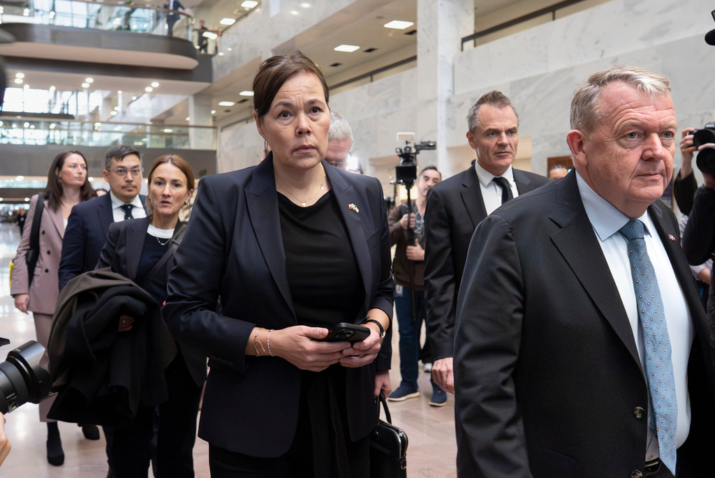 From center to right, Greenland Foreign Minister Vivian Motzfeldt, Denmark's Ambassador Jesper Møller Sørensen, rear, and Danish Foreign Minister Lars Løkke Rasmussen, right, arrive on Capitol Hill to meet with senators from the Arctic Caucus, in Washington, Wednesday, Jan. 14, 2026. (AP Photo/J. Scott Applewhite)
