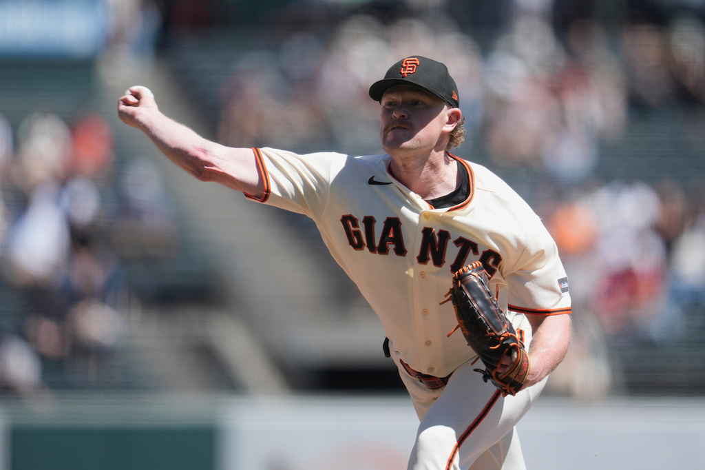 San Francisco Giants pitcher Logan Webb throws against the Cincinnati Reds during the first inning of a baseball game, Wednesday, Aug. 26, 2026, in San Francisco. (AP Photo/Jeff Chiu)