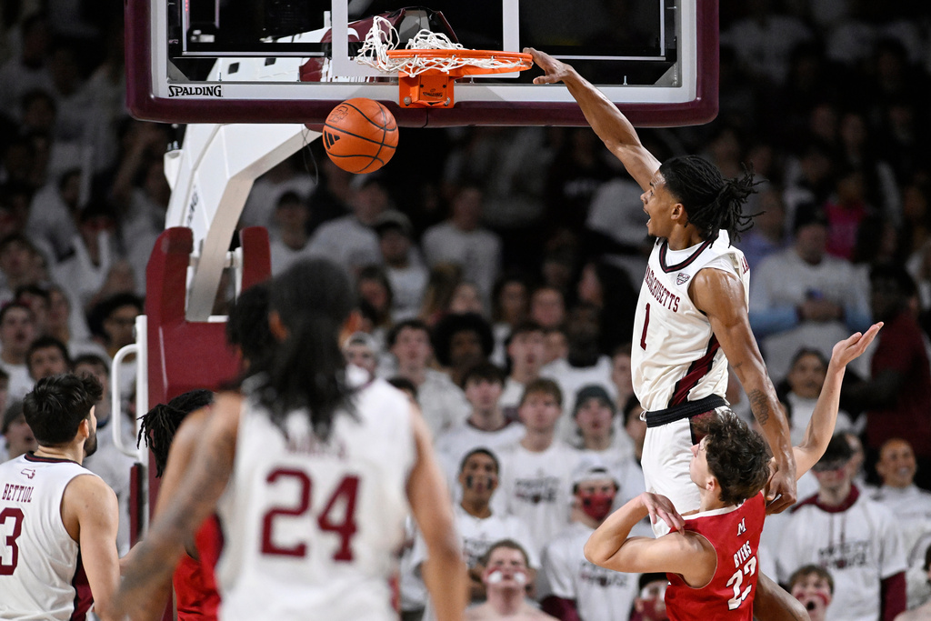 UMass forward Daniel Hankins-Sanford (1) dunks the ball in the first half of an NCAA college basketball game against Miami Ohio, Tuesday, Feb. 17, 2026, in Amherst, Mass. (AP Photo/Jessica Hill)