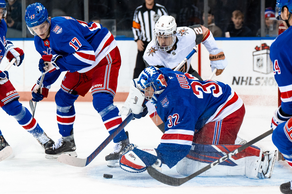 New York Rangers goaltender Jonathan Quick (32) saves a goal during the first period of an NHL hockey game against the Vegas Golden Knights, Sunday, Dec. 7, 2025, in New York. (AP Photo/Angelina Katsanis)