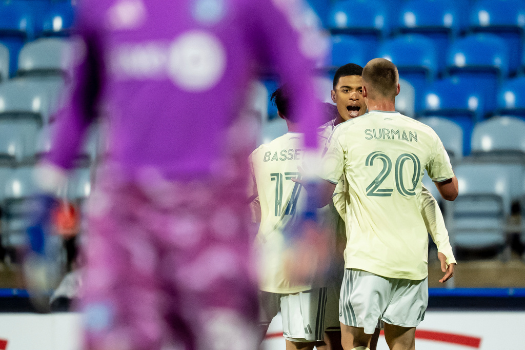 Portland Timbers' Kevin Kelsy, back center, celebrates with teammates after scoring on CF Montreal goalkeeper Thomas Gillier during the first half of an MLS soccer game in Montreal on Wednesday, May 13, 2026. (Christopher Katsarov/The Canadian Press via AP)