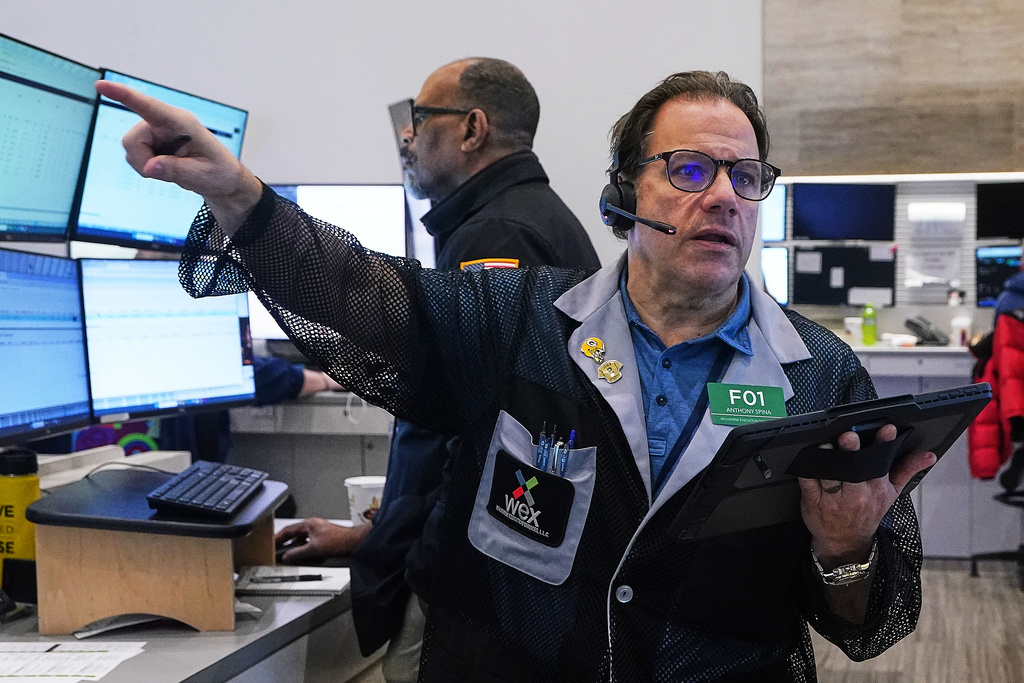 Options trader Anthony Spina works on the floor of the New York Stock Exchange, Monday, Jan. 12, 2026. (AP Photo/Richard Drew)