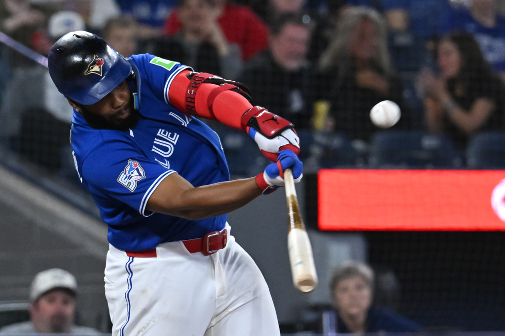 Toronto Blue Jays infielder Vladimir Guerrero Jr. (27) hits a double in sixth inning MLB baseball game action against the Cleveland Guardians in Toronto on Sunday, April 26, 2026. (Jon Blacker/The Canadian Press via AP)