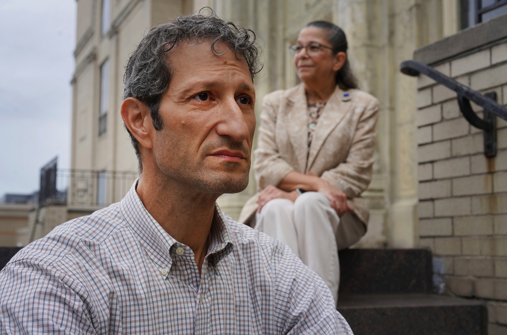 FILE - Rabbi Seth Adelson, of Congregation Beth Shalom, a Conservative synagogue located just blocks from Tree of Life in the Squirrel Hill neighborhood, sits for a portrait with Audrey Glickman, a Tree of Life member who survived the 2018 synagogue attack, Friday, Sept. 27, 2024, in Pittsburgh. (AP Photo/Jessie Wardarski, File)