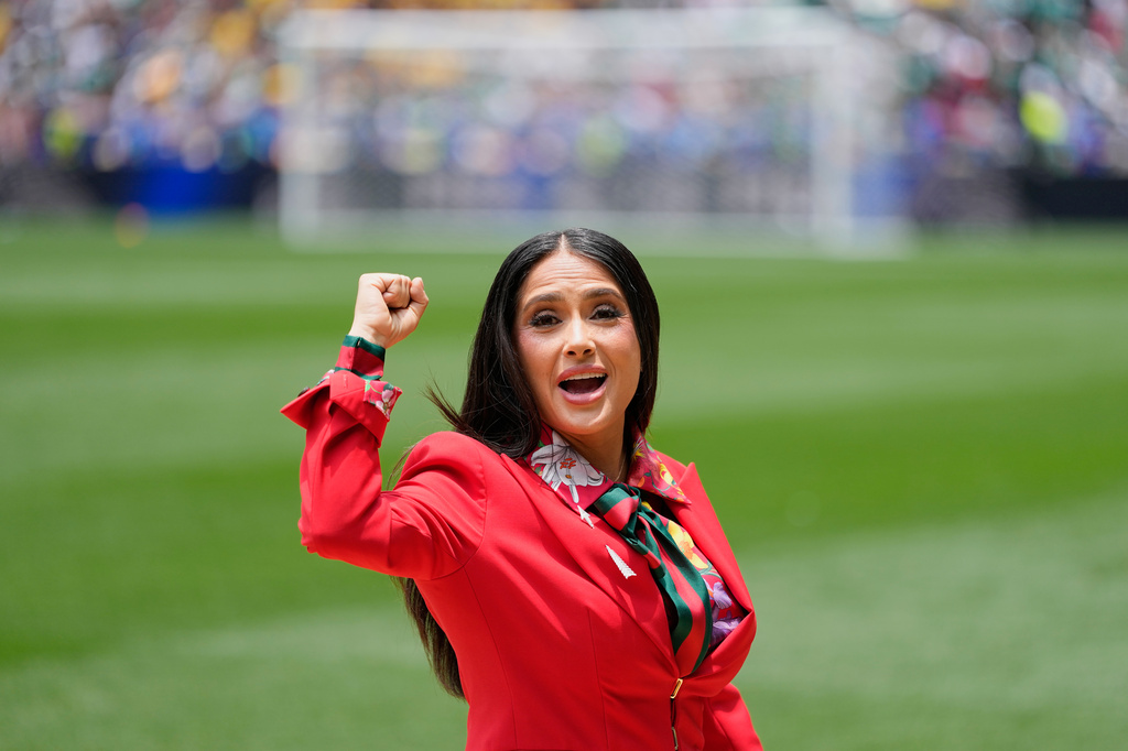 Mexican-American actress Salma Hayek gestures on the pitch before the start of the World Cup Group A soccer match between Mexico and South Africa in Mexico City, Thursday, June 11, 2026. (AP Photo/Natacha Pisarenko)