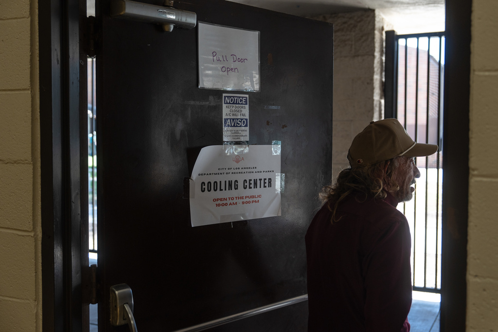 FILE - Daniel Aragonez leaves a cooling center in Los Angeles, July 31, 2026. (AP Photo/Jae C. Hong, File)