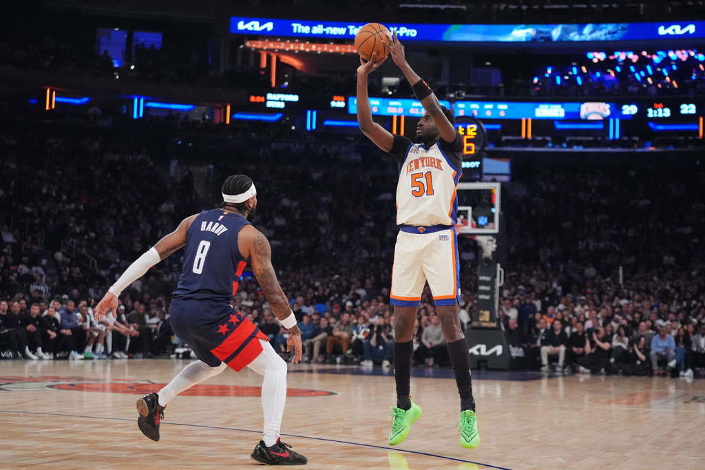 New York Knicks' Mohamed Diawara (51) shoots over Washington Wizards' Jaden Hardy (8) during the first half of an NBA basketball game Sunday, March 22, 2026, in New York. (AP Photo/Frank Franklin II)