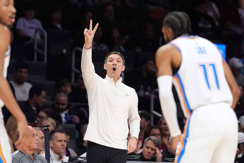 Oklahoma City Thunder head coach Mark Daigneault gestures to his players during the first half of an NBA basketball game against the Miami Heat, Saturday, Jan. 17, 2026, in Miami. (AP Photo/Rebecca Blackwell)