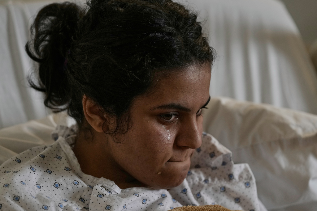 Syrian Razan al-Jassem, who was wounded in an Israeli airstrike, lies in Rayak Hospital in eastern Lebanon, Saturday, Feb. 21, 2026. (AP Photo/Bilal Hussein)