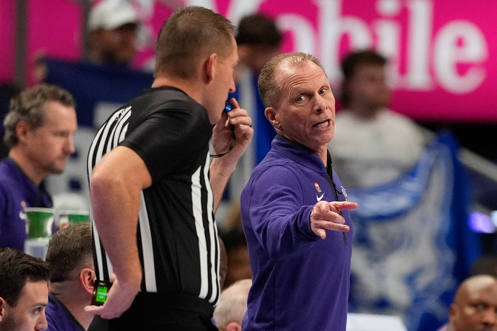 Kansas State interim head coach Matthew Driscoll talks to an official during the first half of an NCAA college basketball game against BYU at the Big 12 Conference tournament Tuesday, March 10, 2026, in Kansas City, Mo. (AP Photo/Charlie Riedel)