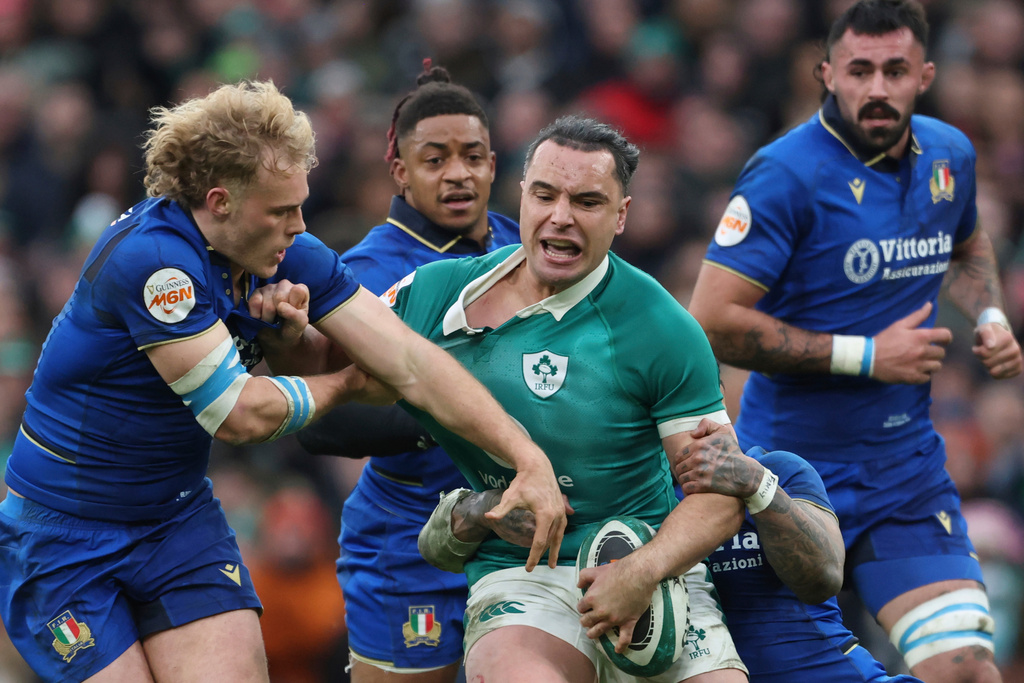 Ireland's James Lowe, is tackled by Italy's Monty Ioane, right, during a Six Nations rugby union match between Ireland and Italy in Dublin, Ireland, Saturday, Feb. 14, 2026. (AP Photo/Peter Morrison)