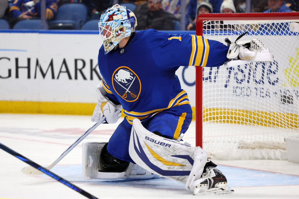 Buffalo Sabres goaltender Ukko-Pekka Luukkonen slides across the crease to make a save during the second period of an NHL hockey game against the Winnipeg Jets, Monday, Dec. 1, 2025, in Buffalo, N.Y. (AP Photo/Jeffrey T. Barnes)