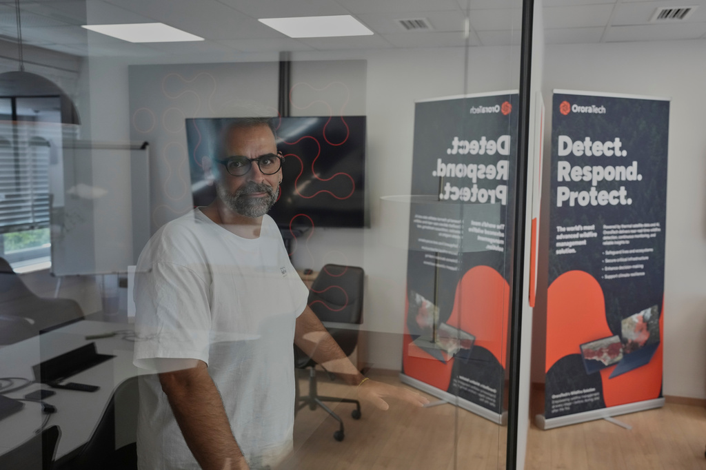 Ioannis Lantounis, head of OroraTech's Greek operations, stands inside the company's Athens office on Thursday, June 18, 2026, as Greece integrates a new constellation of wildfire-detection satellites into its national firefighting system. (AP Photo/Petros Giannakouris)