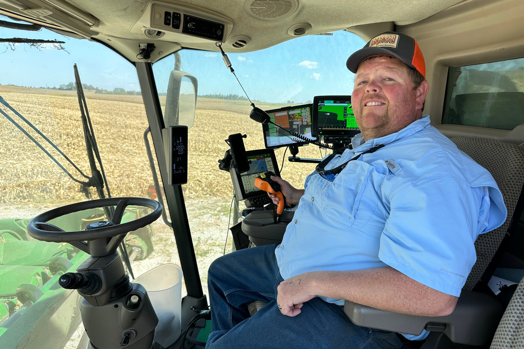 Kentucky Farmer Caleb Ragland sits in his combine while harvesting corn in Magnolia, Ky., Sept. 12, 2025. (AP Photo/Dylan Lovan)