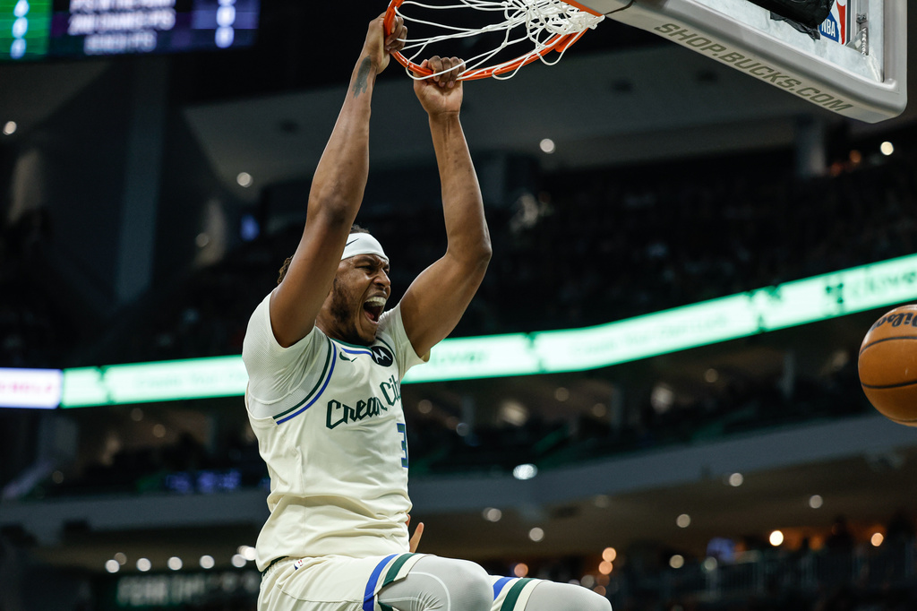 Milwaukee Bucks center Myles Turner reacts after dunking during the first half of an NBA basketball game against the Brooklyn Nets, Friday, April 10, 2026, in Milwaukee. (AP Photo/Jeffrey Phelps)