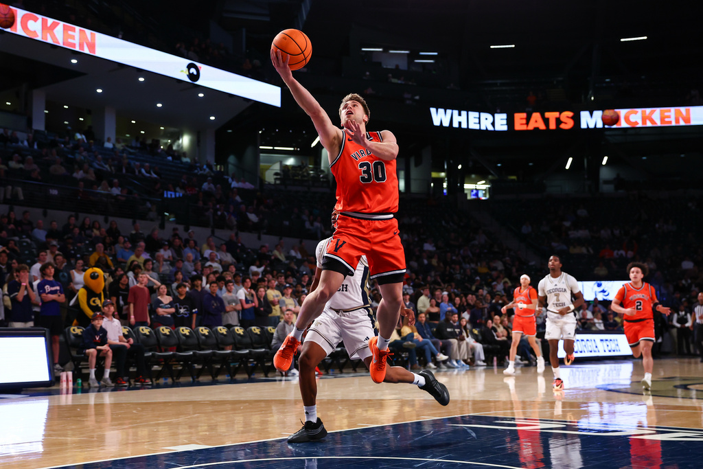 Virginia guard Dallin Hall (30) shoots during the first half of an NCAA college basketball game against Georgia Tech, Wednesday, Feb. 18, 2026, in Atlanta. (AP Photo/Colin Hubbard)