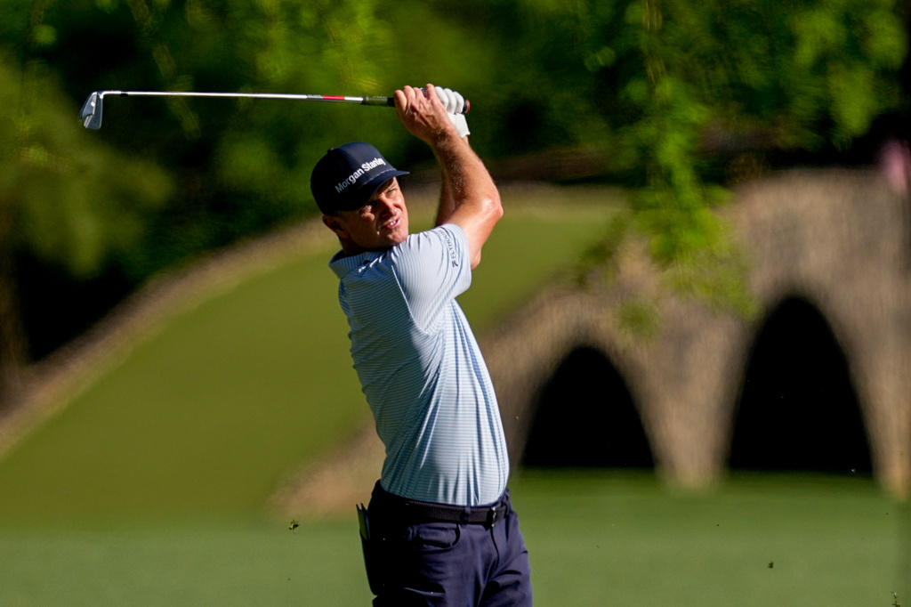 Justin Rose, of England, hits from the fairway on the 13th hole during the first round of the Masters golf tournament at the Augusta National Golf Club, Thursday, April 9, 2026, in Augusta, Ga. (AP Photo/David J. Phillip)
