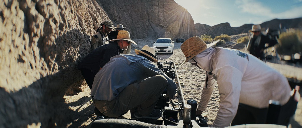 This image released by Warner Bros. Pictures shows camera/steadicam operator Colin Anderson filming a scene from "One Battle After Another." (Michael Bauman/Warner Bros. Pictures via AP)
