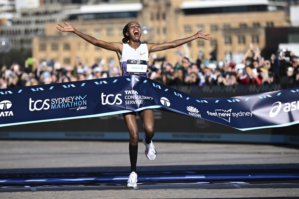 Sifan Hassan of the Netherlands reacts as she crosses the finish line to win the women's division of the Sydney Marathon in Sydney, Sunday, Aug. 31, 2025. (Bianca De Marchi/AAP Image via AP)
