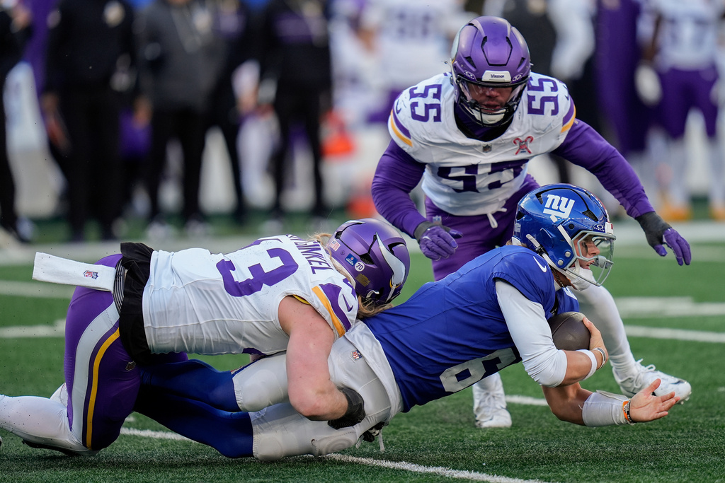 New York Giants quarterback Jaxson Dart (6) is sacked by Minnesota Vikings outside linebacker Andrew van Ginkel (43) during the second quarter of an NFL football game, Sunday, Dec. 21, 2025, in East Rutherford, N.J. (AP Photo/Seth Wenig)