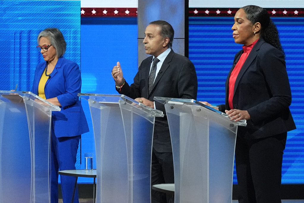 U.S. Rep. Raja Krishnamoorthi (D-Ill.), center, speaks as U.S. Rep. Robin Kelly (D-Ill.), left, and Illinois Lt. Gov. Juliana Stratton (D), listen to him during U.S. senate Democratic Primary Debate in Chicago, Thursday, Feb. 19, 2026. (AP Photo/Nam Y. Huh)
