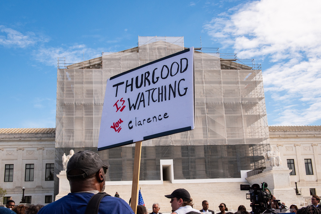 Protestors demonstrate in front of the Supreme Court as the court hears arguments in the Louisiana case drawing new congressional district boundaries, Wednesday, Oct. 15, 2025, in Washington. (AP Photo/Cliff Owen)