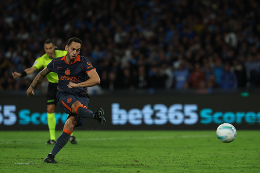 Inter Milan's Hakan Calhanoglu scores their side's first goal of the game during the Italian Serie A soccer match between Napoli and Inter Milan, in Naples, Italy, Saturday, Oct. 25, 2025. (Alessandro Garofalo/LaPresse via AP) Inter Milan's Hakan Calhanoglu scores their side's first goal of the game during the Italian Serie A soccer match between Napoli and Inter Milan, in Naples, Italy, Saturday, Oct. 25, 2025. (Alessandro Garofalo/LaPresse via AP)