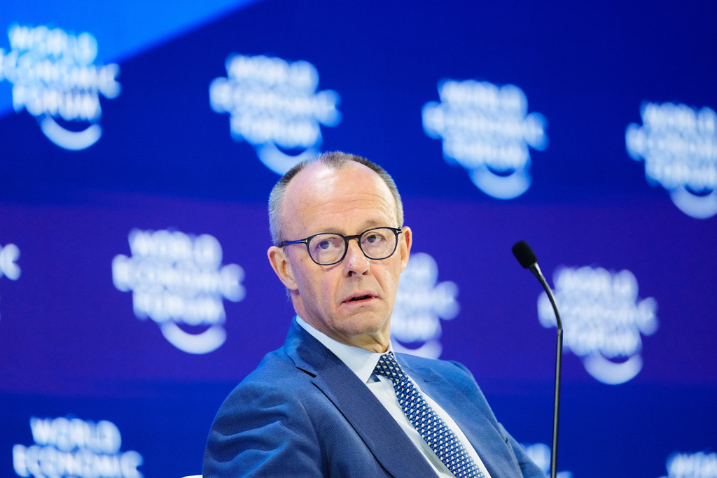 German Chancellor Friedrich Merz sits on the podium during the Annual Meeting of the World Economic Forum in Davos, Switzerland, Thursday, Jan. 22, 2026. (AP Photo/Markus Schreiber)