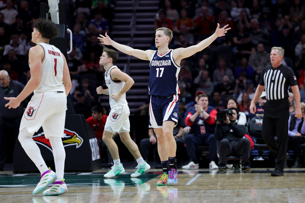 Gonzaga guard Mario Saint-Supery (17) celebrates after a three-point basket as Seattle University guard Maleek Arington (1) and guard Jojo Murphy walk off during the second half of an NCAA college basketball game Saturday, Jan. 17, 2026, in Seattle. (AP Photo/Ryan Sun)