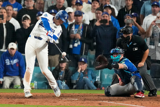 Los Angeles Dodgers' Freddie Freeman hits a walk off home run against the Toronto Blue Jays during the 18th inning in Game 3 of baseball's World Series, Monday, Oct. 27, 2025, in Los Angeles.(AP Photo/Mark J. Terrill) Los Angeles Dodgers' Freddie Freeman hits a walk off home run against the Toronto Blue Jays during the 18th inning in Game 3 of baseball's World Series, Monday, Oct. 27, 2025, in Los Angeles.(AP Photo/Mark J. Terrill)