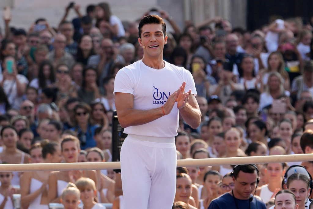 FILE - Renowned Italian dancer Roberto Bolle directs the 'white dance' during the event 'One Dance' in front of the Duomo gothic cathedral, in Milan, Italy, Sunday, Sept. 10, 2023. (AP Photo/Luca Bruno, File)