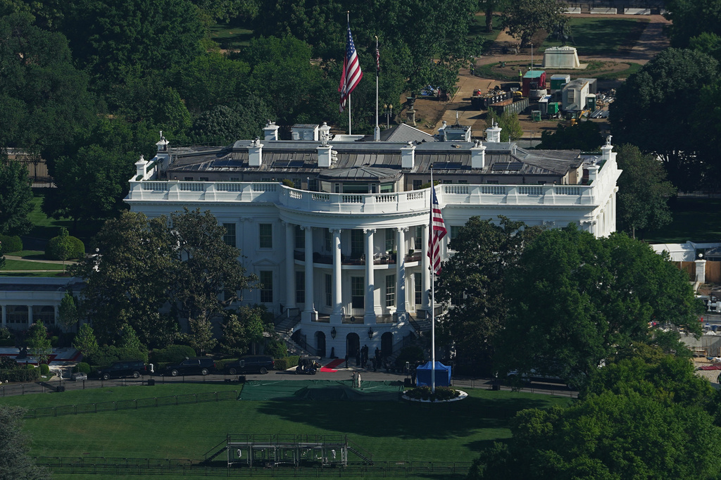 The White House is seen from the Washington Monument, Monday, April 27, 2026, in Washington. King Charles III and Queen Camilla arrive in the U.S. today for a four-day state visit aimed at celebrating the United States' 250th anniversary, including a White House state dinner and a speech to Congress. (AP Photo/Matt Rourke)