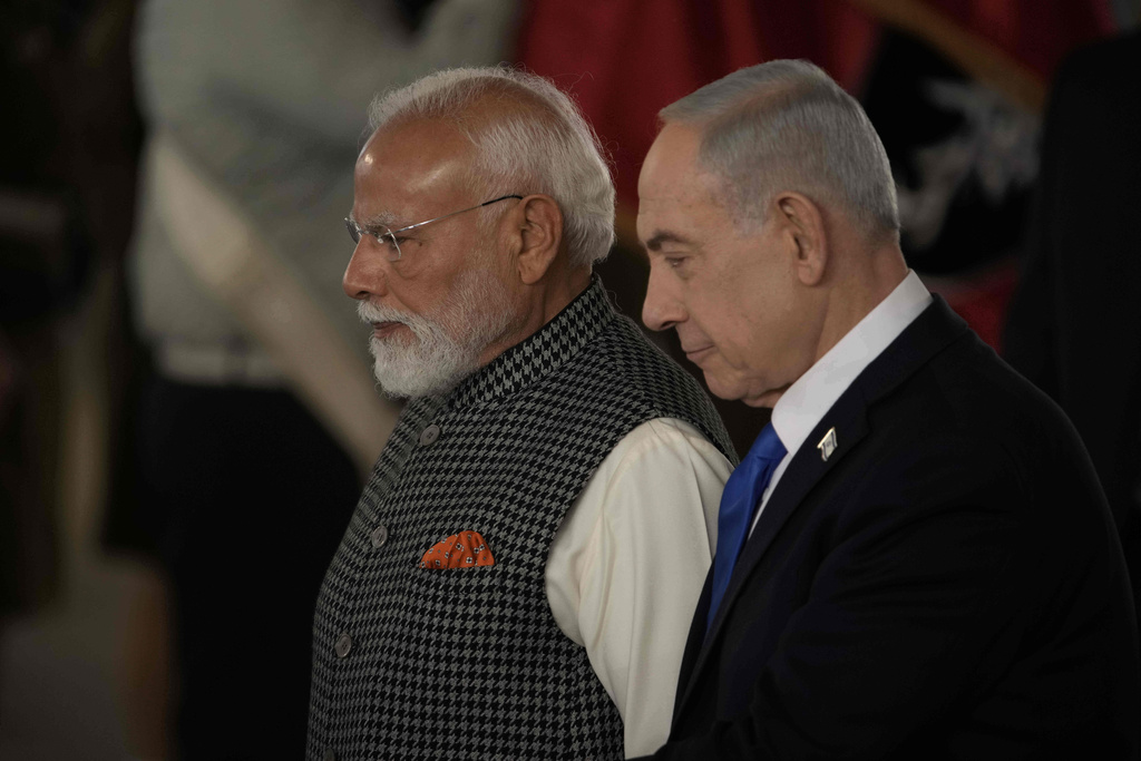 Israel's Prime Minister Benjamin Netanyahu, right, welcomes Indian Prime Minister Narendra Modi as he arrives at Ben Gurion Airport near Tel Aviv, Israel, Wednesday, Feb. 25, 2026. (AP Photo/Leo Correa)